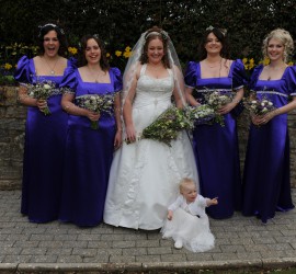 Purple bridesmaids with bride